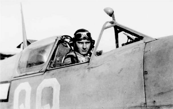 Hoover sitting in a Spitfire cockpit